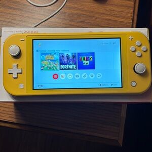Nintendo switch lite yellow with animal crossing game